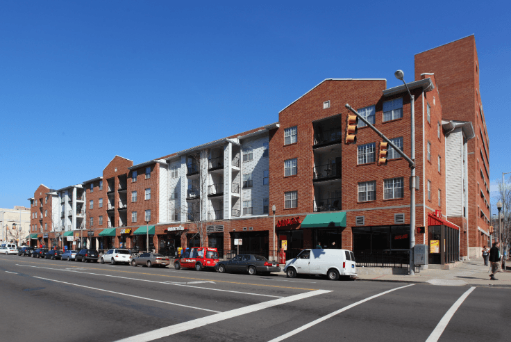 a large red brick building on a city street